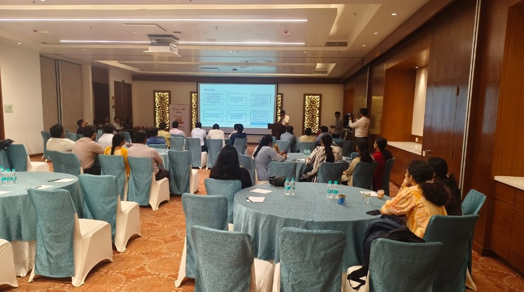Seminar room with a case-study presentation and audience