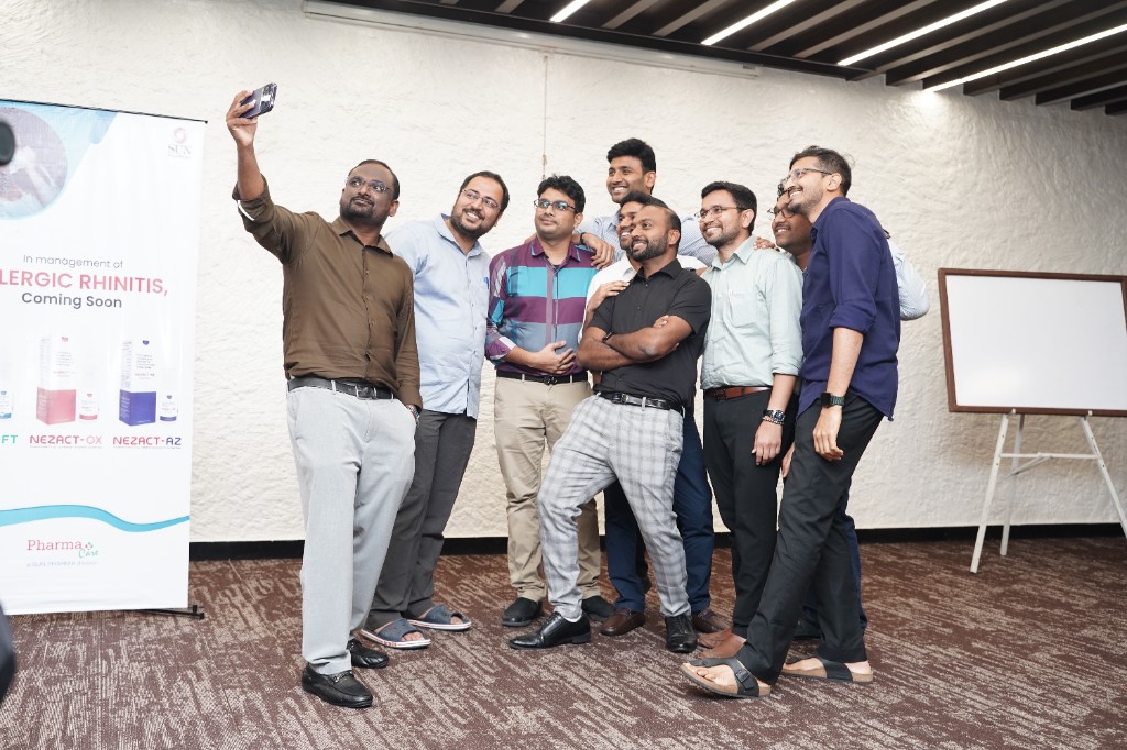 Colleagues taking a group photo during the meet