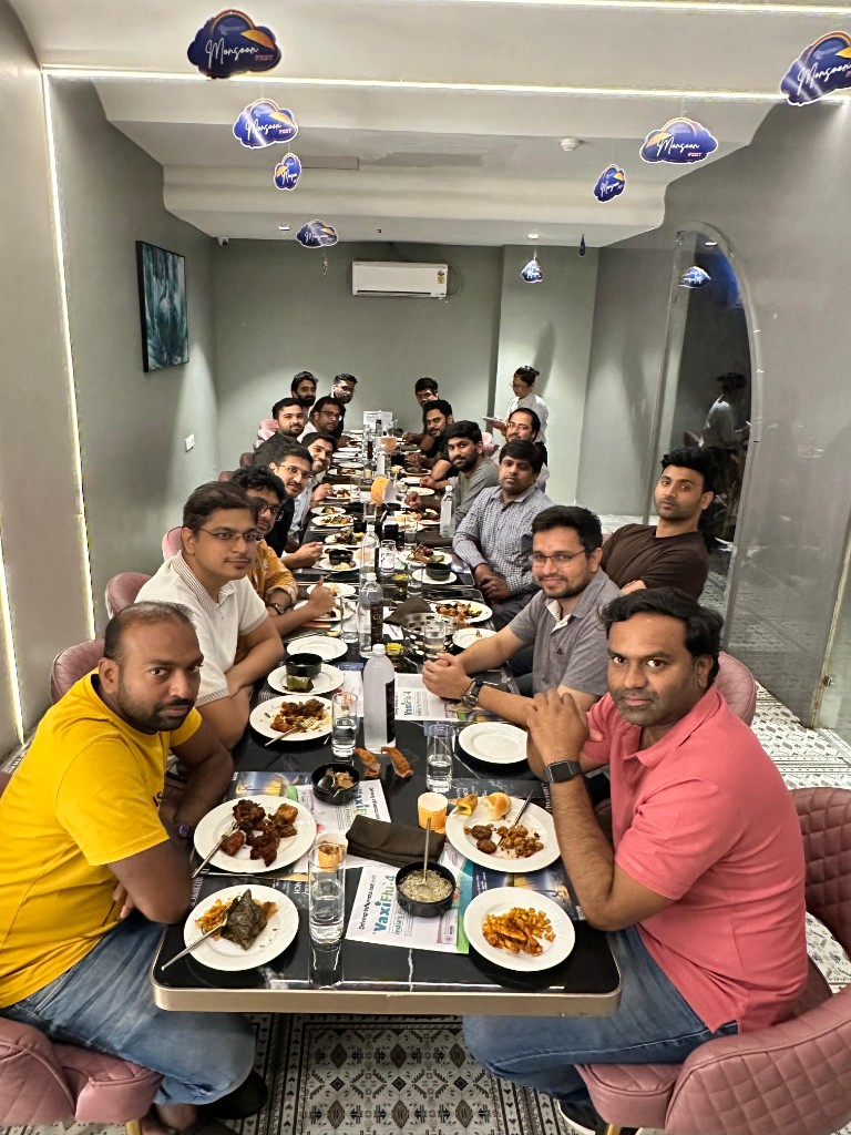 Long table networking dinner with colleagues seated together