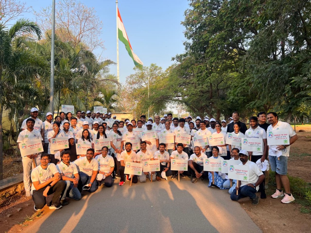 Large group at the TB awareness walkathon on a tree-lined path