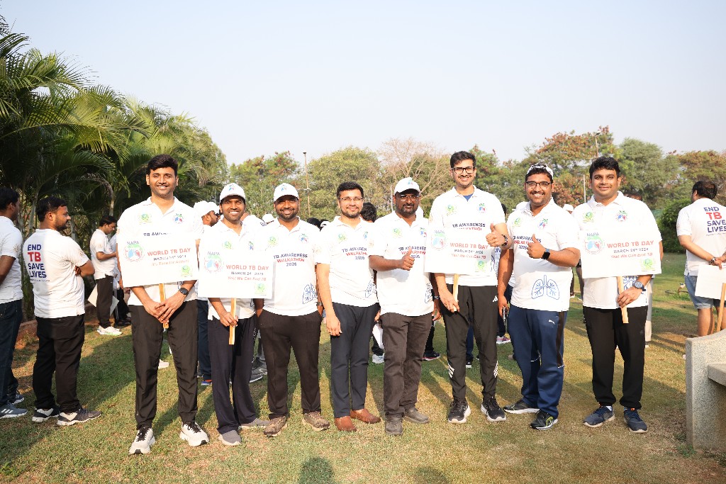 Walkathon participants holding TB awareness signs